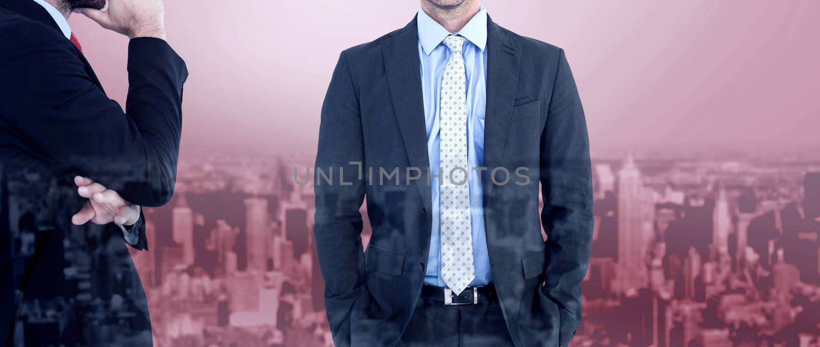 Businessman looking at the camera against high angle view of city