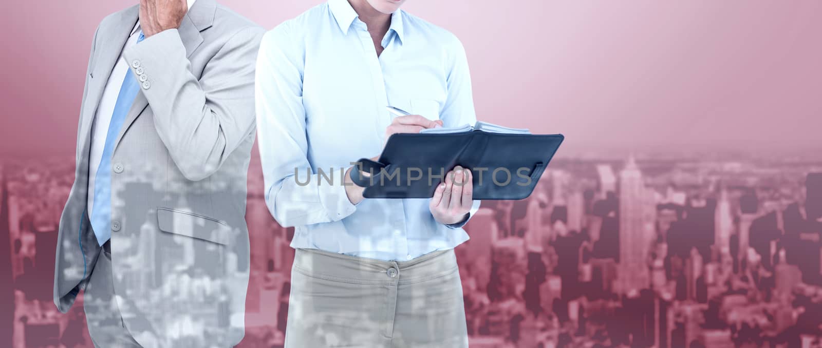 Businesswoman writing in her diary  against high angle view of city