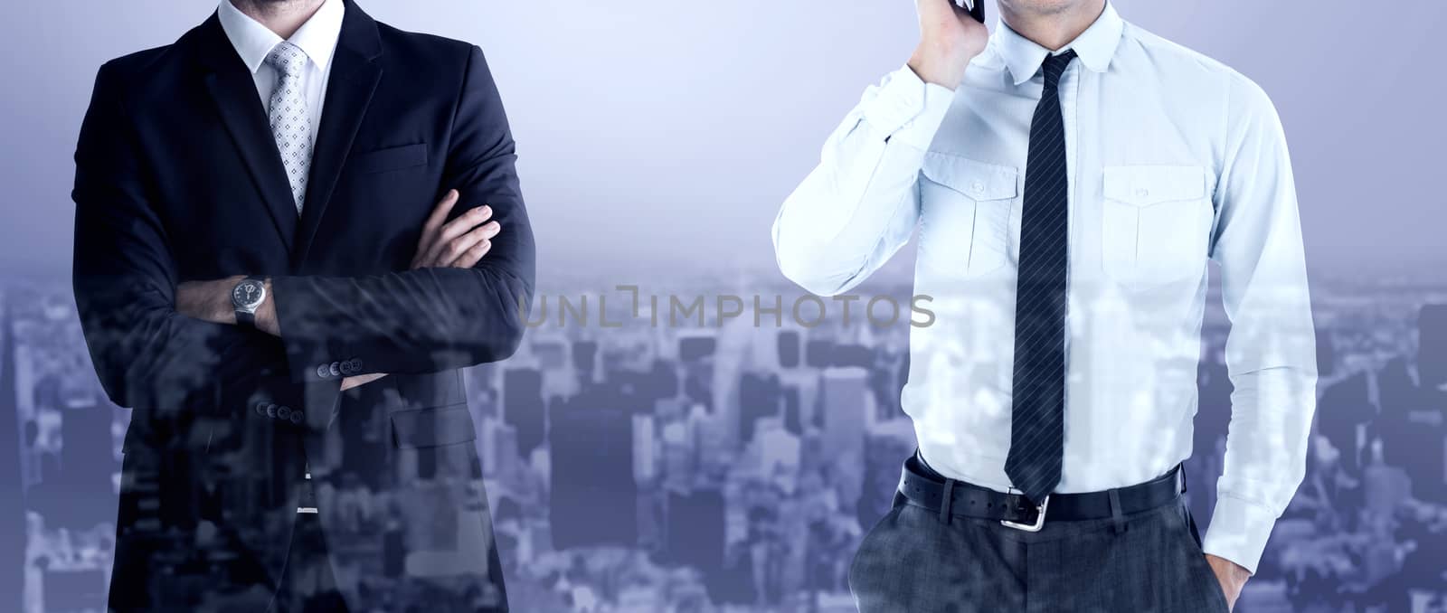 Businessman on the phone against high angle view of city
