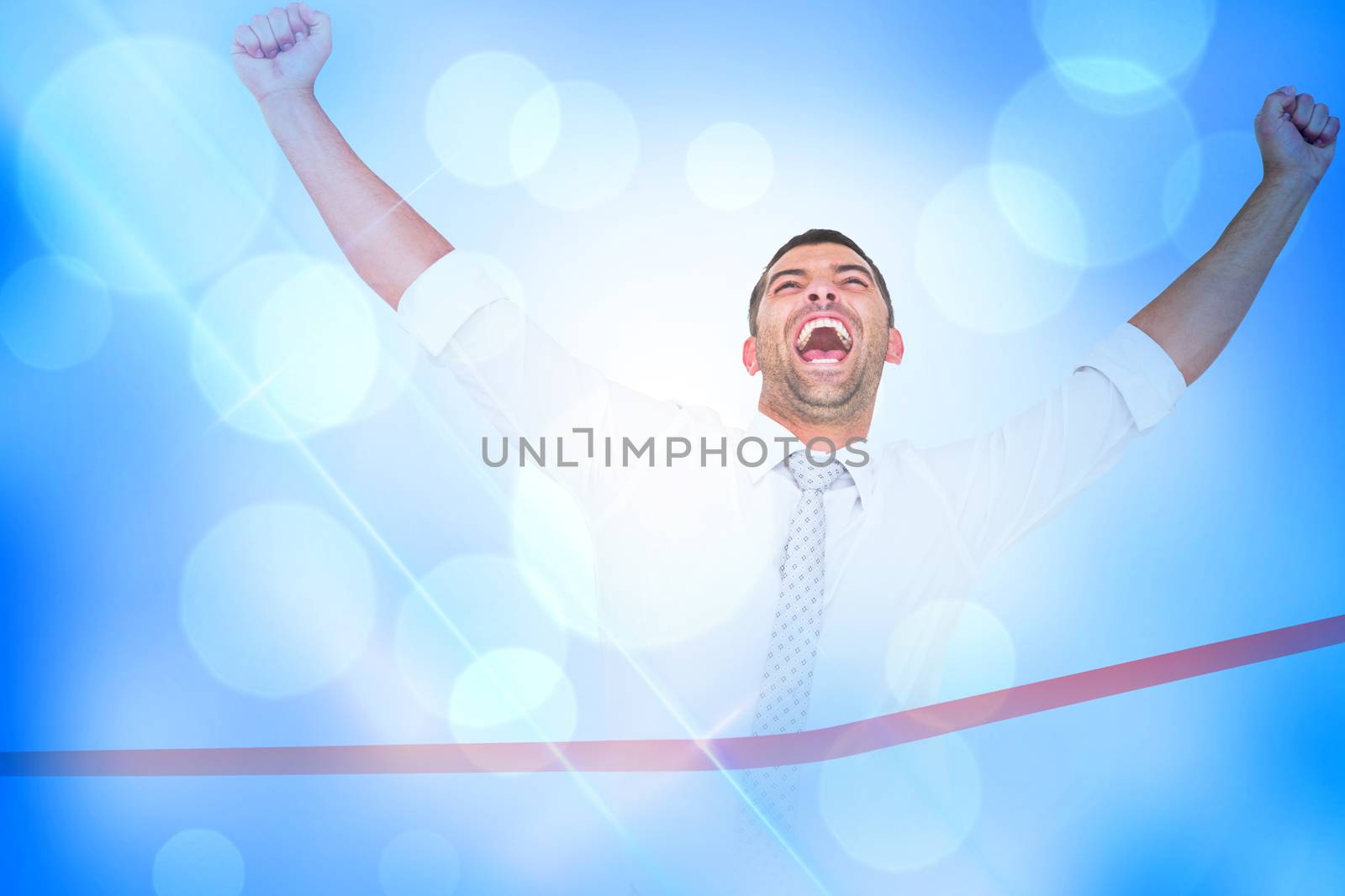 Composite image of businessman crossing the finish line by Wavebreakmedia