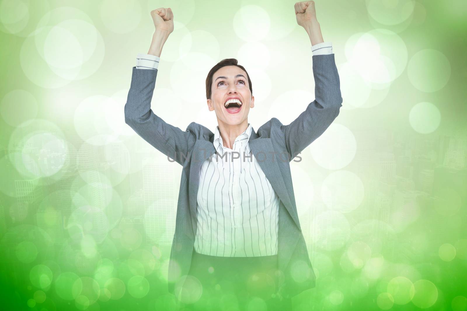 Composite image of cheering businesswoman by Wavebreakmedia