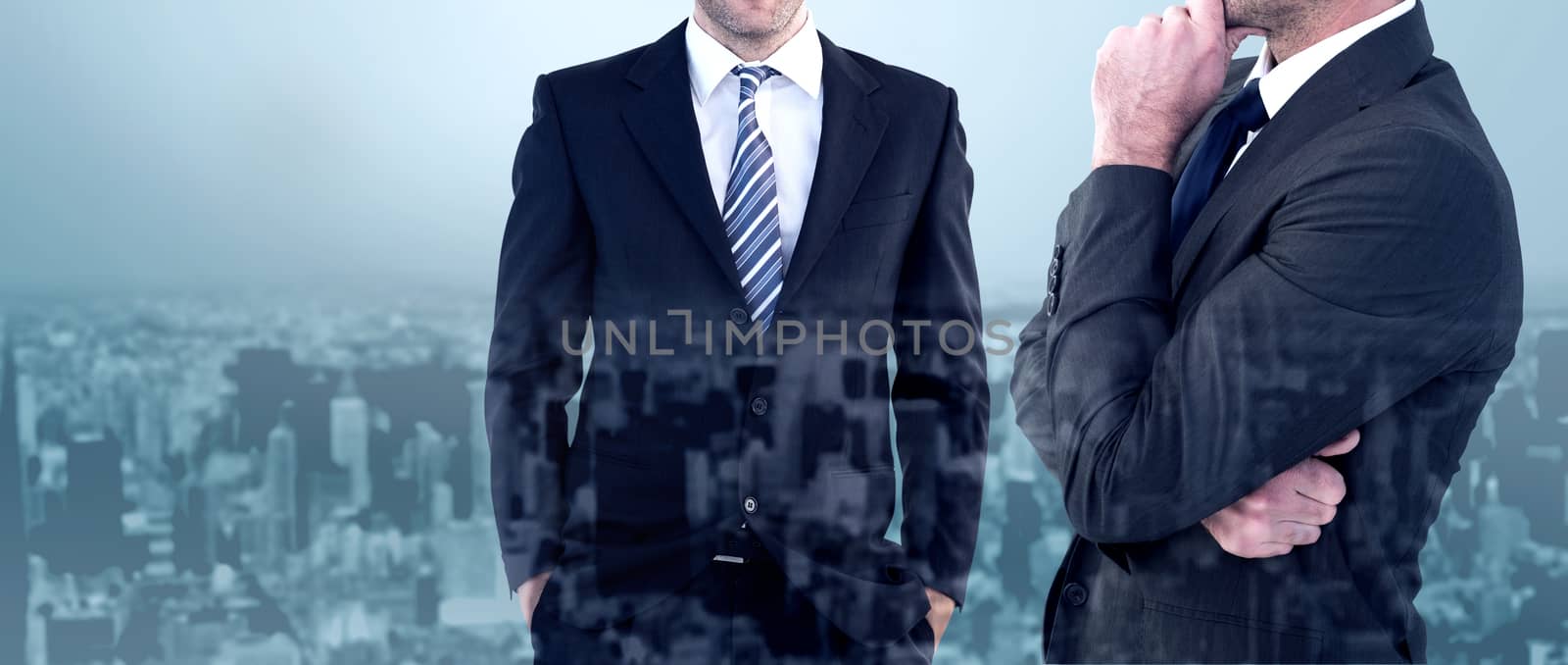 Frowning businessman thinking  against high angle view of city