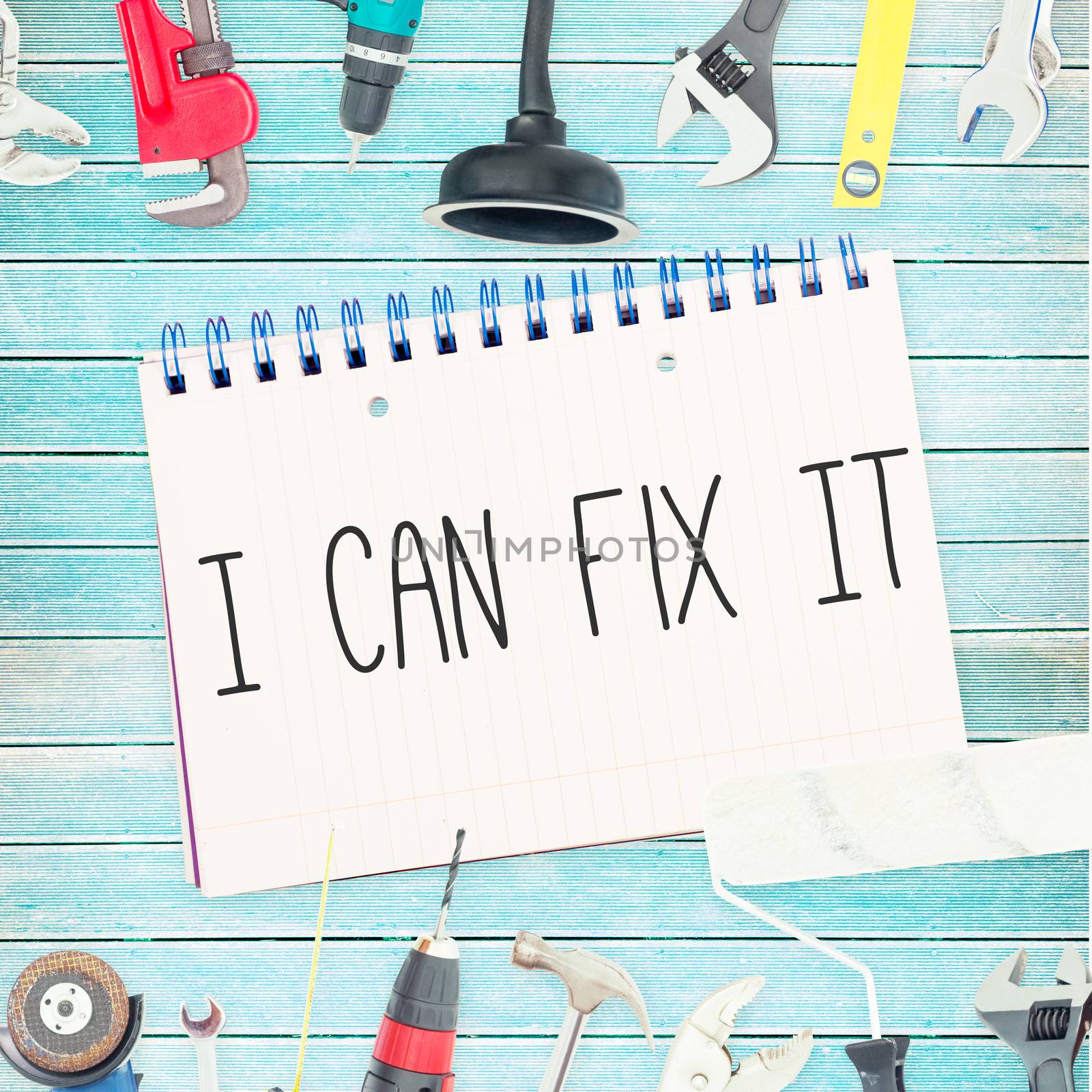The word i can fix it against tools and notepad on wooden background