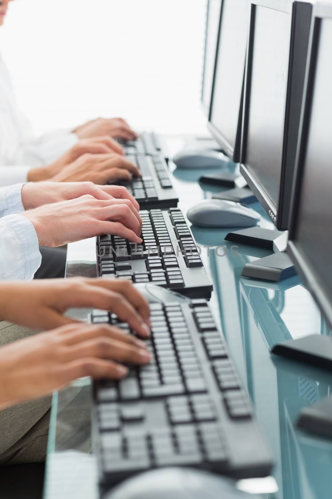 Close up of business people using computer in office 