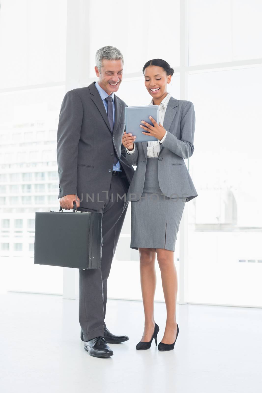 Business people using tablet computer in office 