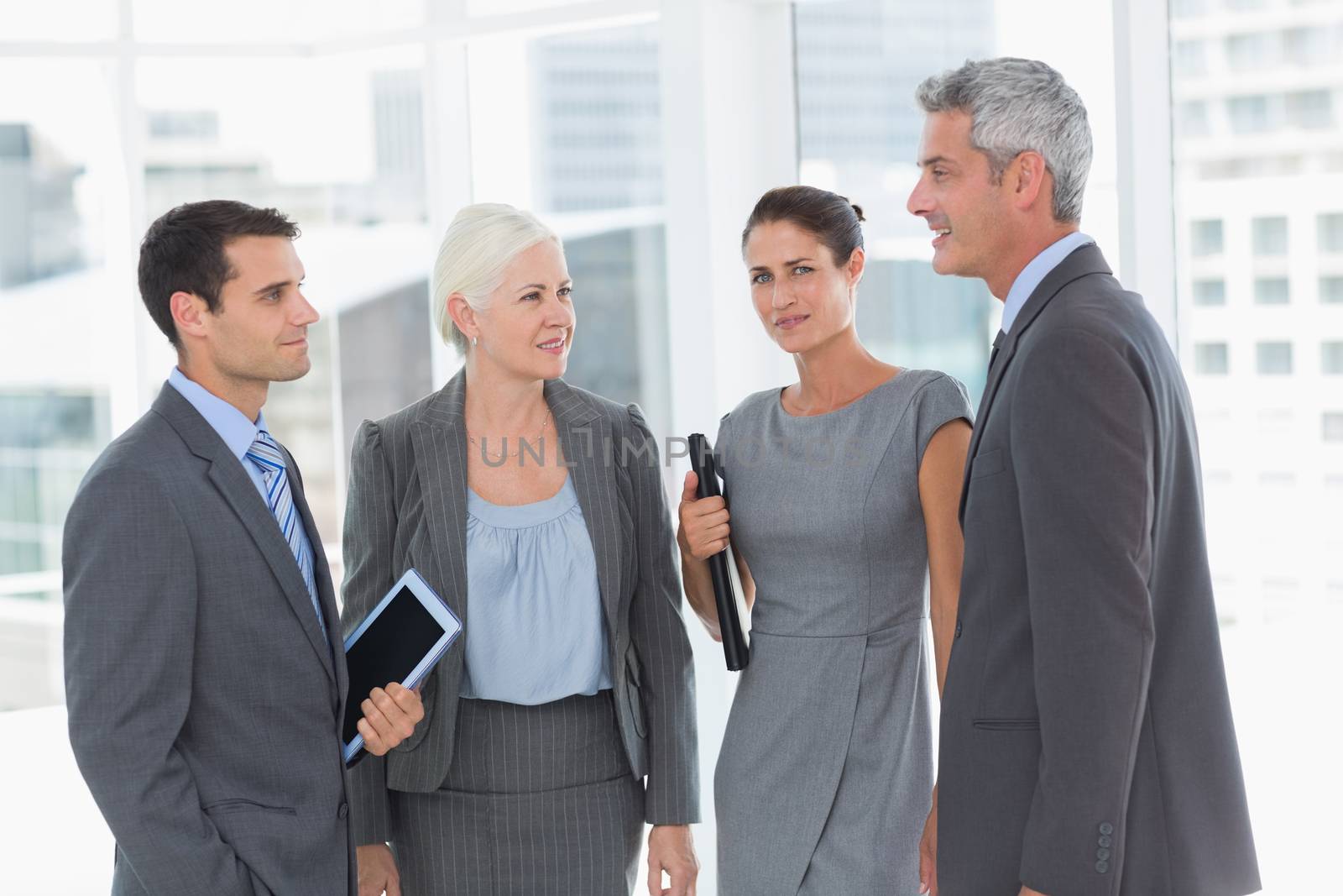 happy business people standing in office