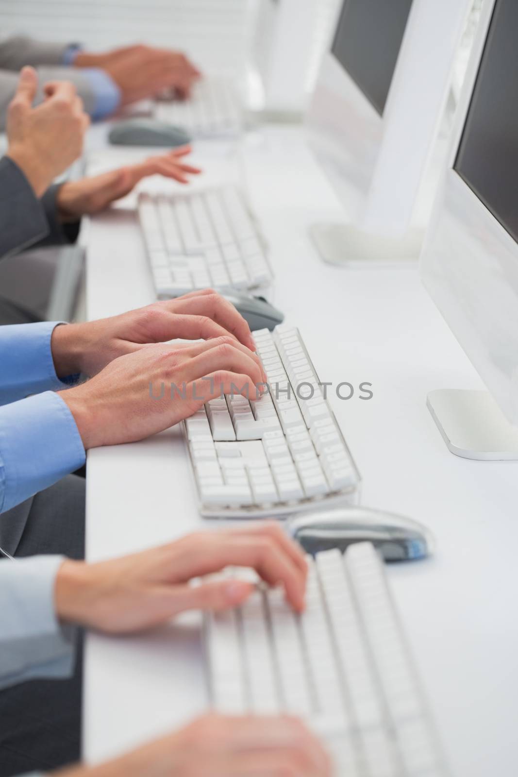 Business team working on computers in call center