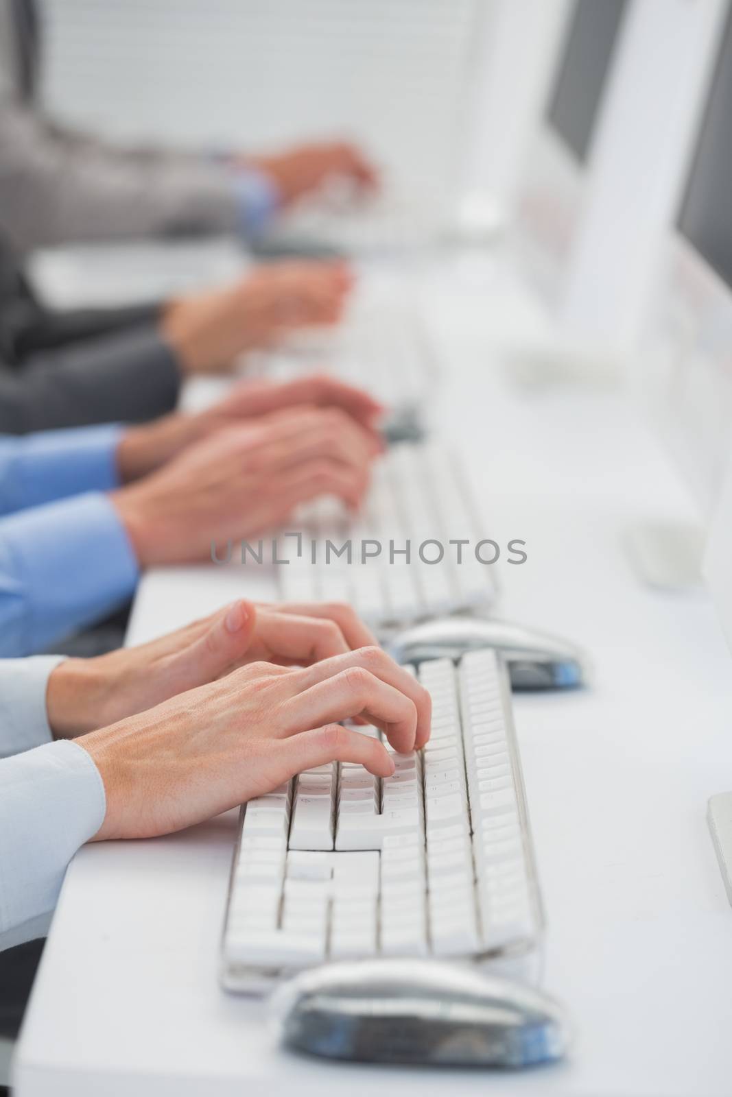 Business team working on computers in call center