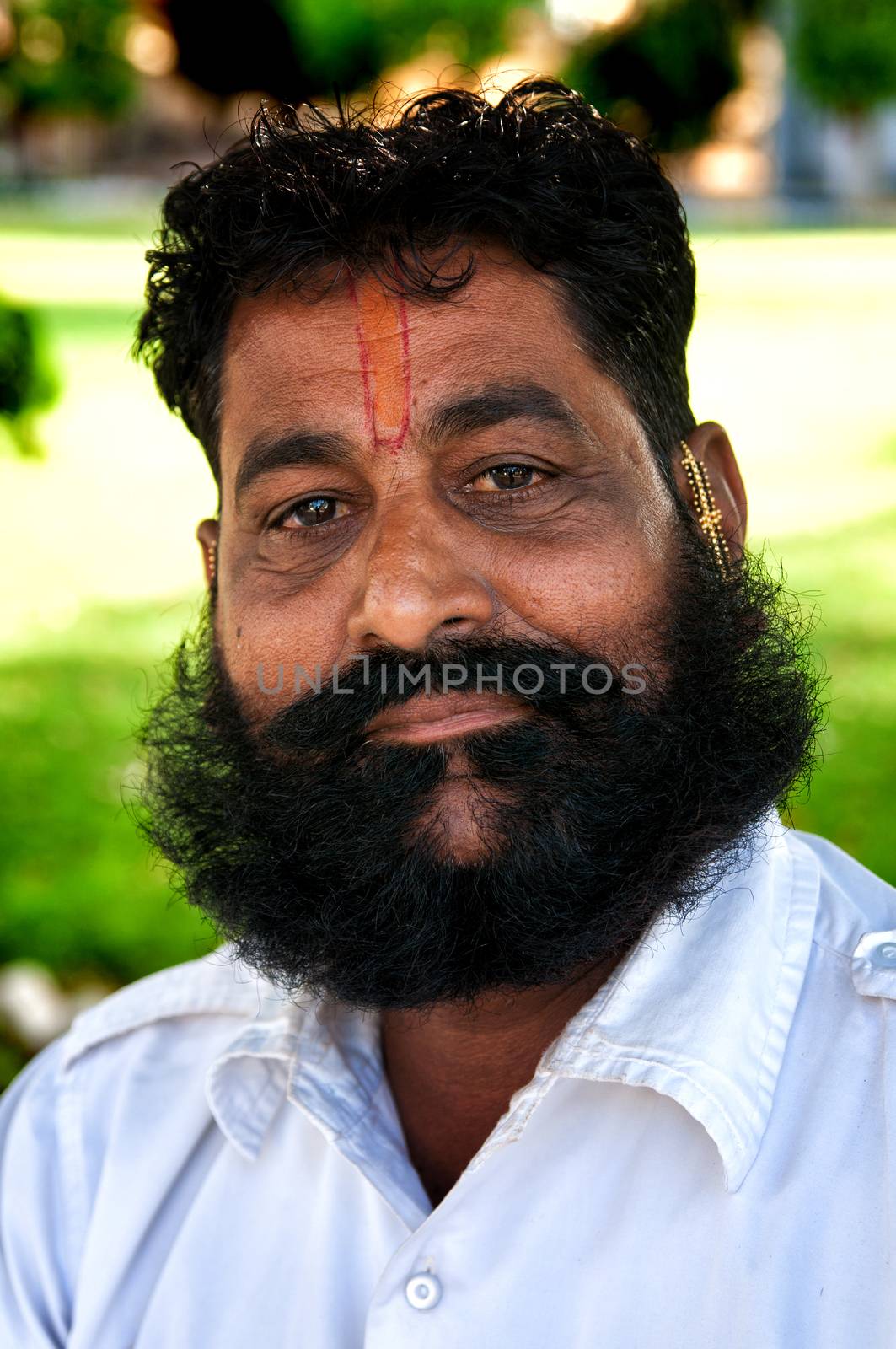 BIKANER, INDIA - MARCH 09, 2013: Portrait od undefined man with mustache styled as maharaja by johnnychaos