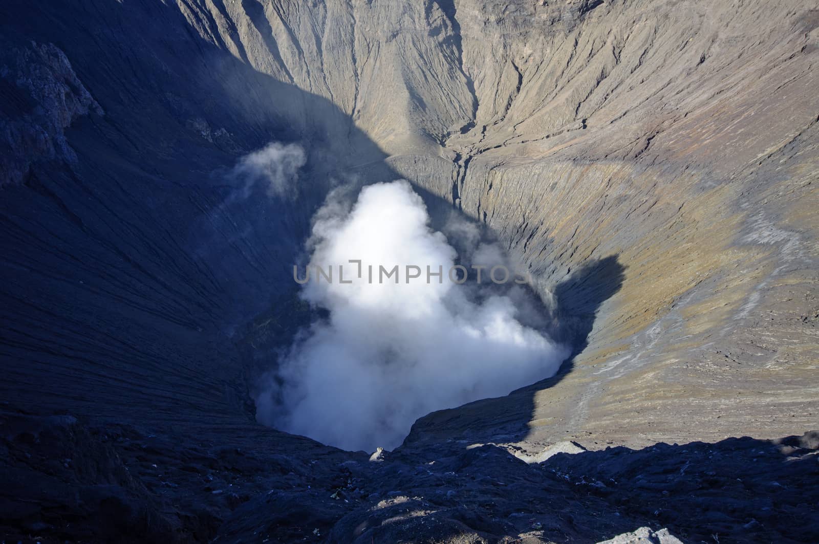Crater of the Bromo volcano in Indonesia by johnnychaos