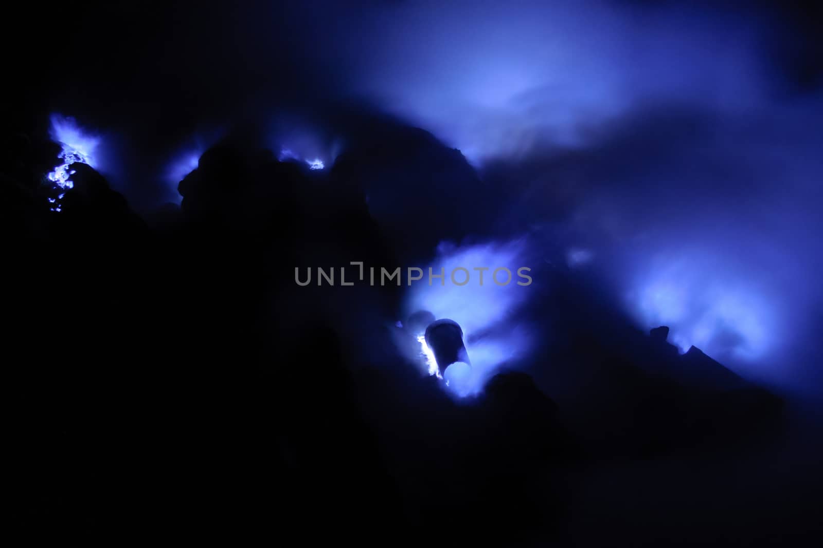 Blue fire on sulfur mining point in Ijen volcano in East Java in Indonesia.