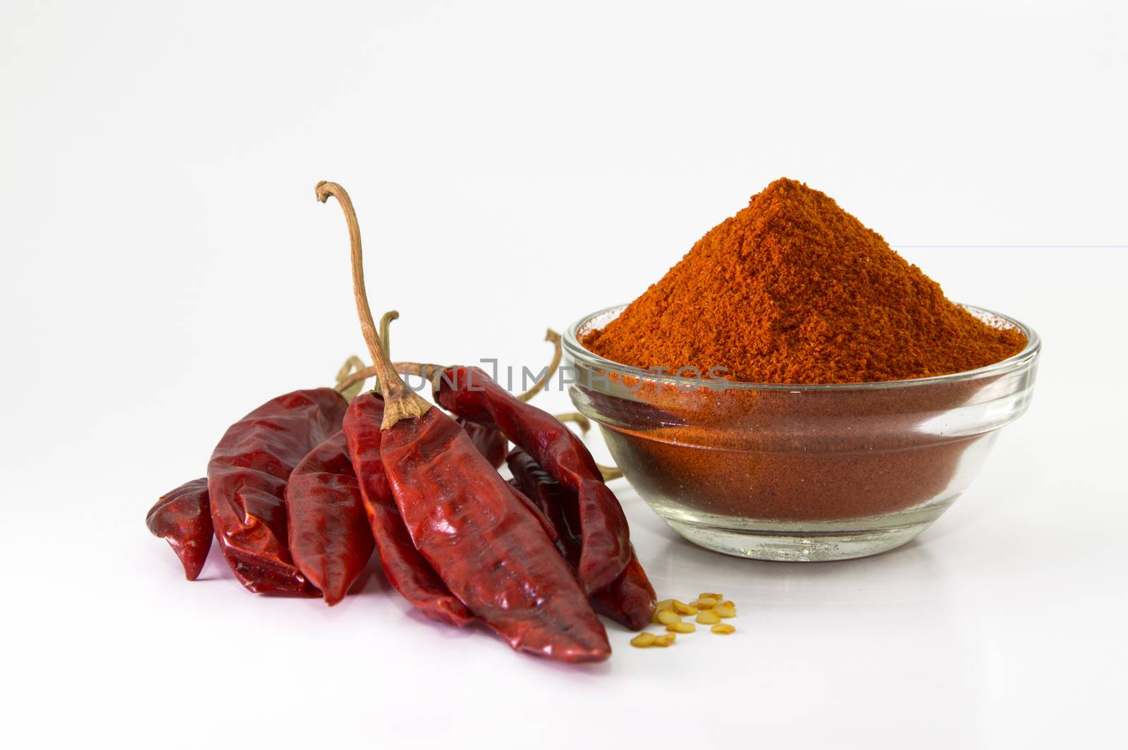 chilly powder in bowl with red chilly, dried chillies