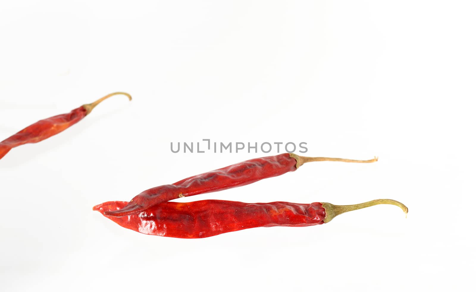 Red Chilli peppers isolated on white background