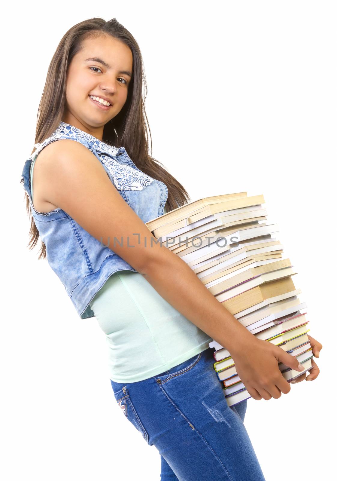 young student girl holding a stack of books by manaemedia