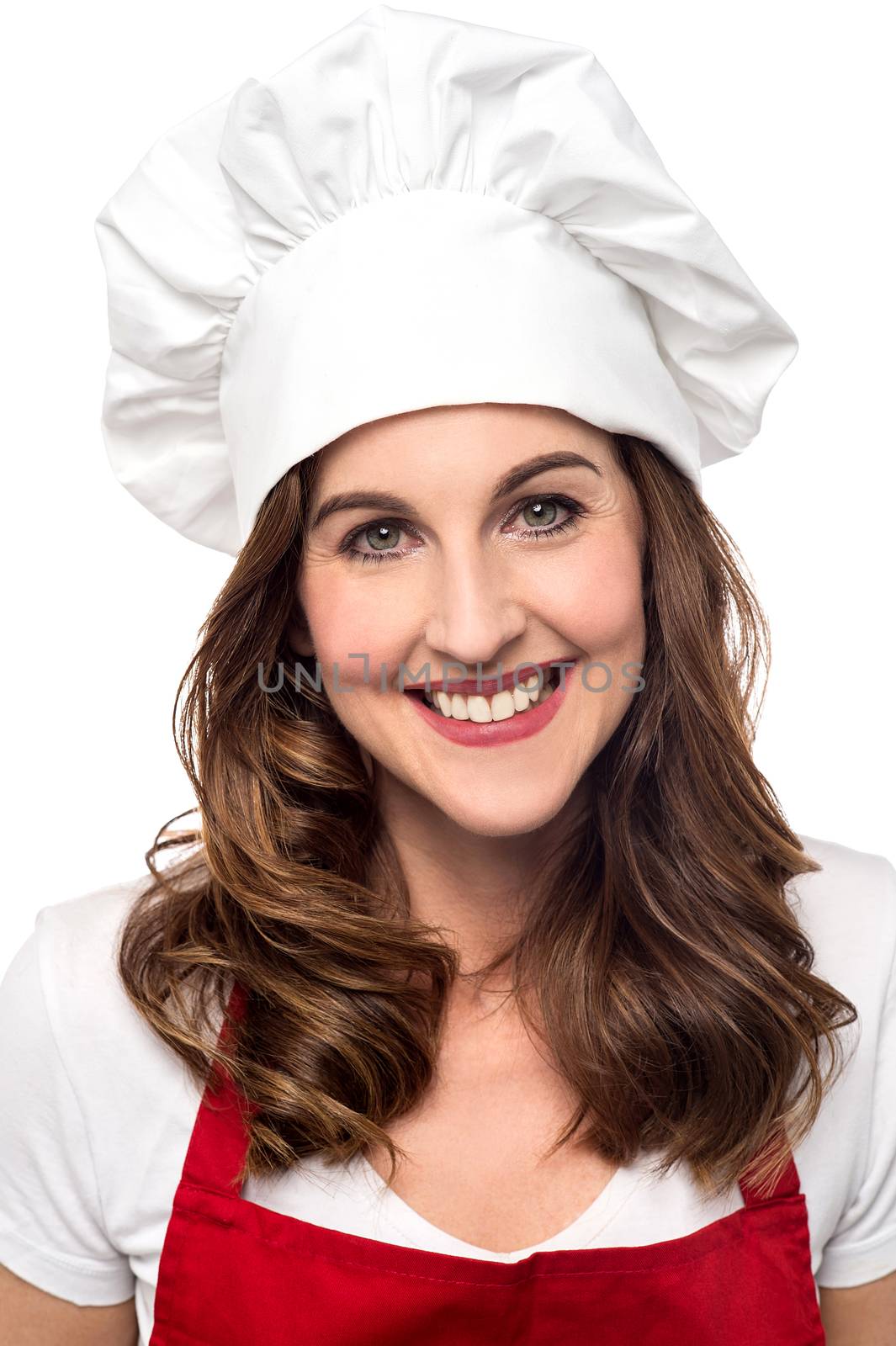 Smiling female chef isolated over white