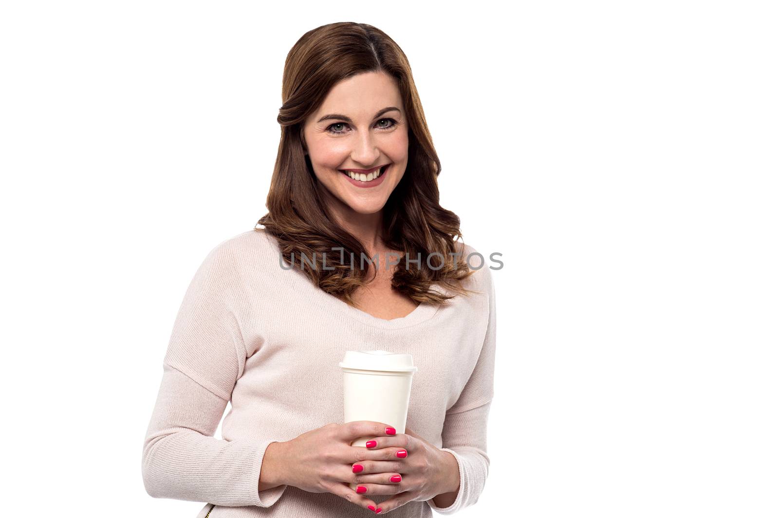 Smiling woman posing with disposable cup