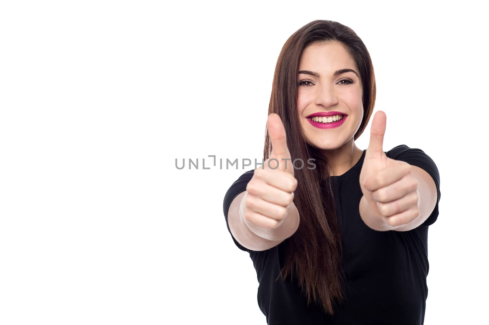 Young woman making thumb up gesture by two hands