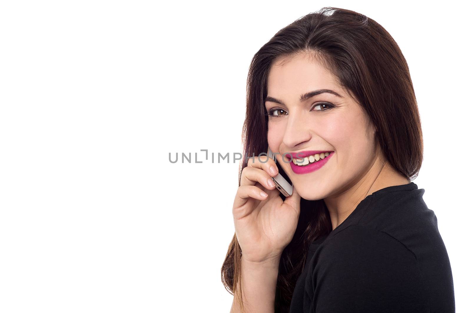 Side pose of woman talking on her cell phone