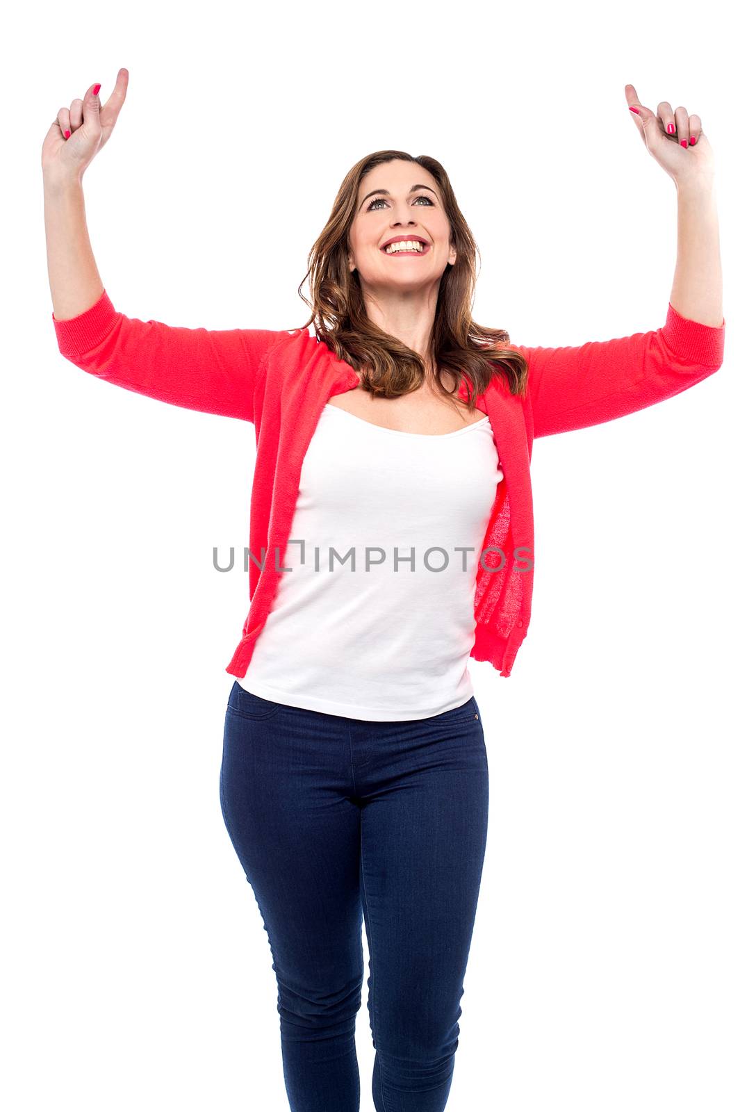 Happy woman celebrating with her arms raised
