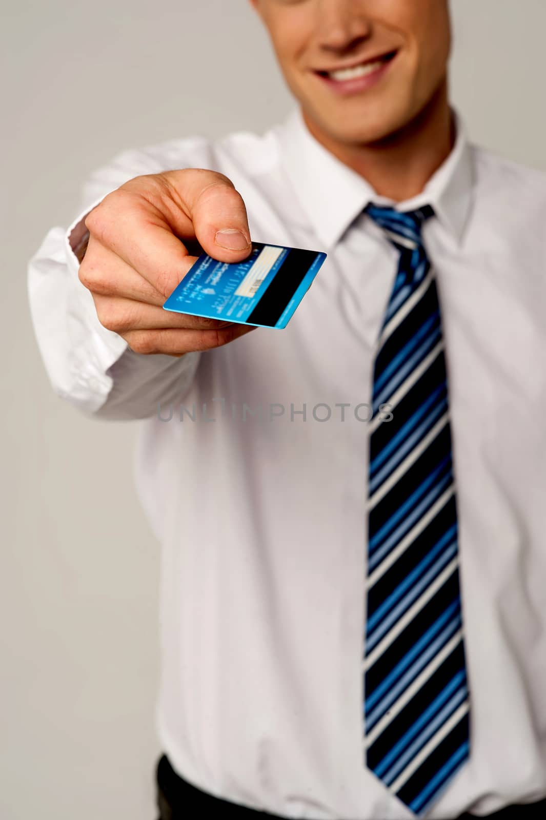 Cropped image of businessman giving his credit card
