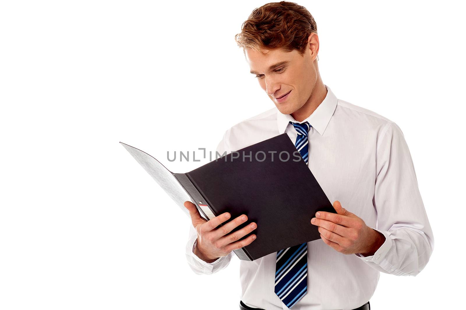 Businessman reviewing records. by stockyimages