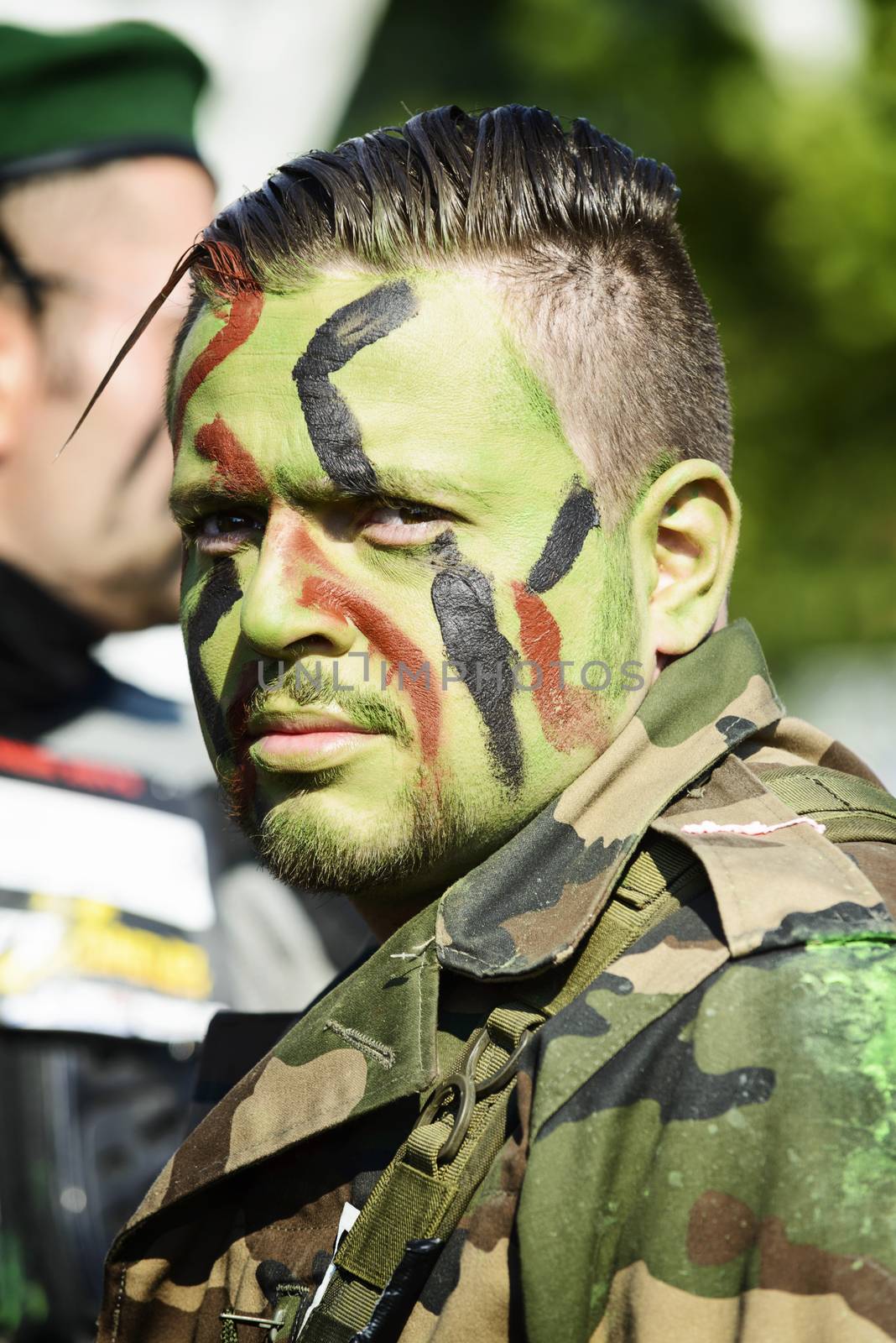 LYON, FRANCE - MAY 24: A man dressed in military commando,  Frappadingue race participating in the event in the Miribel Jonage Park to Lyon on May 25, 2015. People from all walks of life participated in the run.