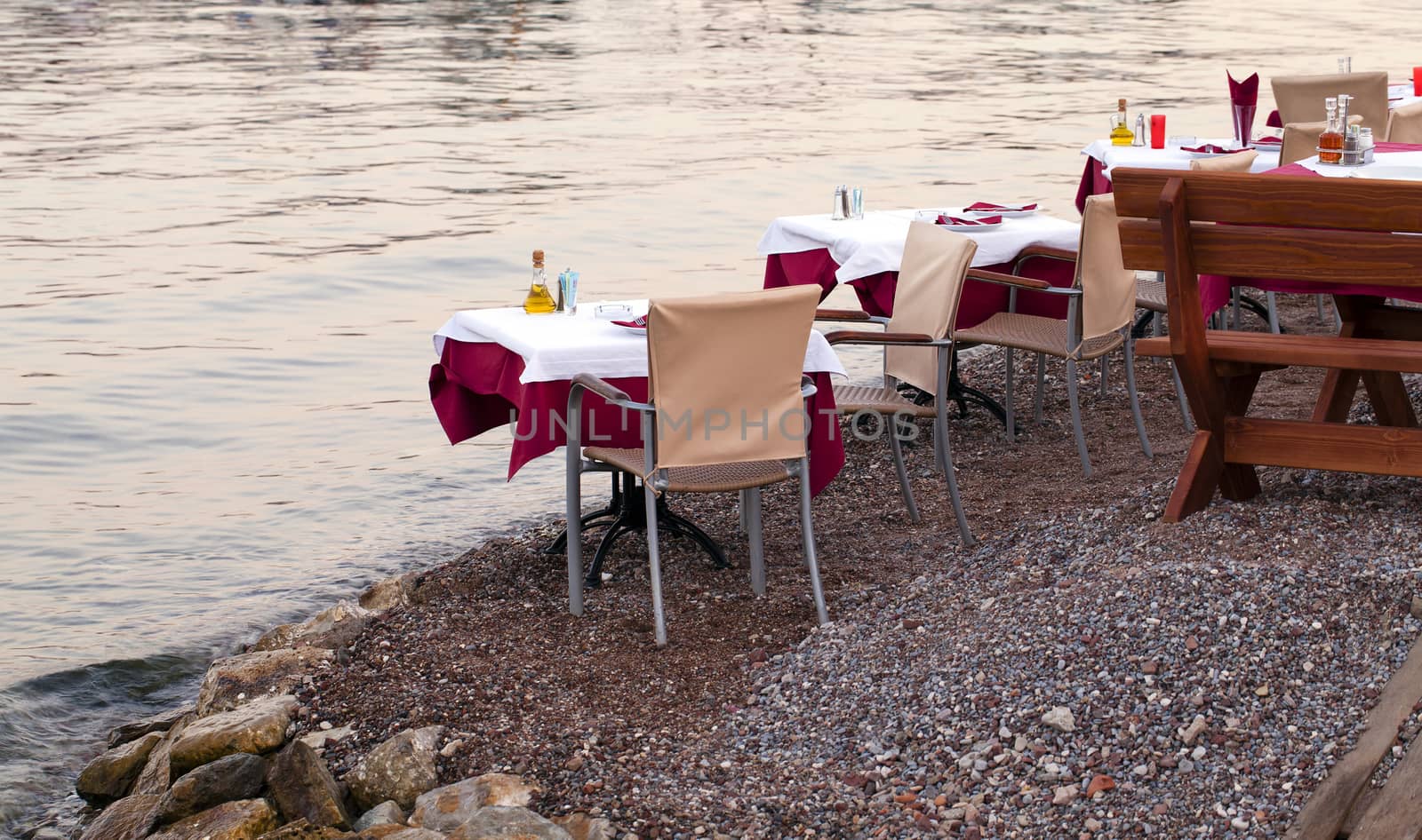   some little tables of the restaurant, standing near a bay. Montenegro