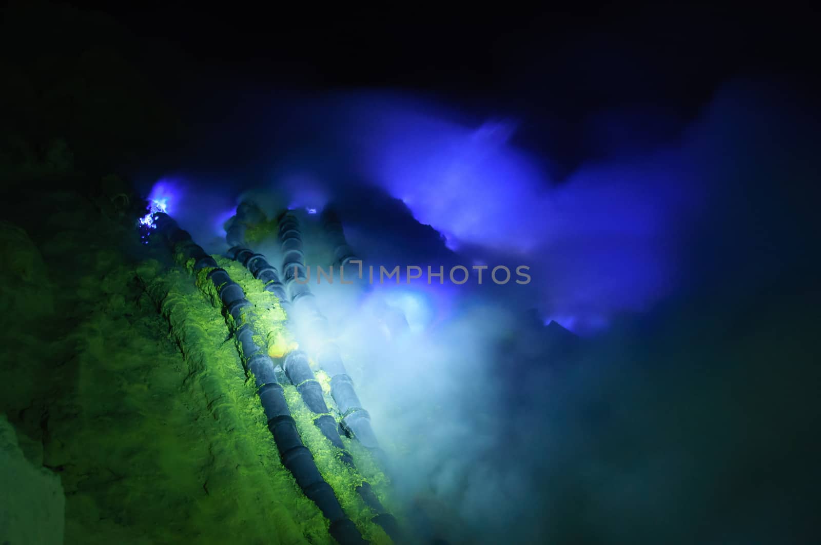 Blue fire on sulfur mining point in Ijen volcano in East Java in Indonesia.