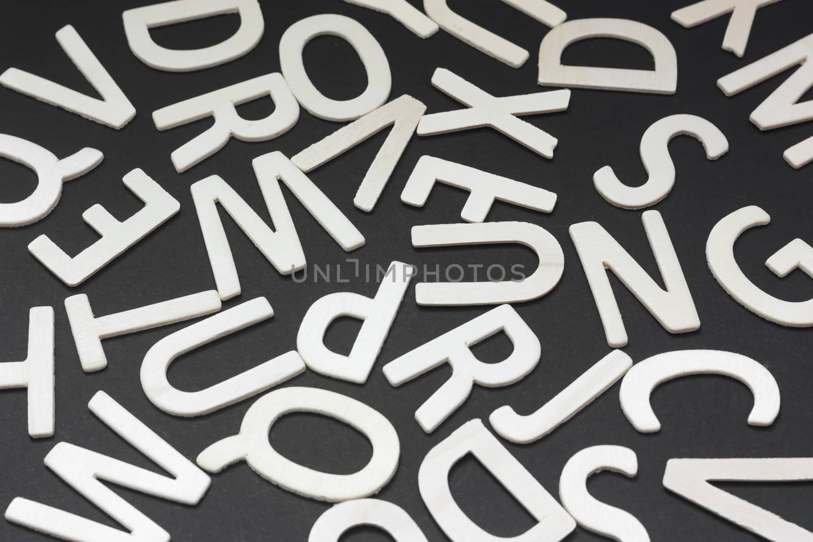 Letters of wood on a black background