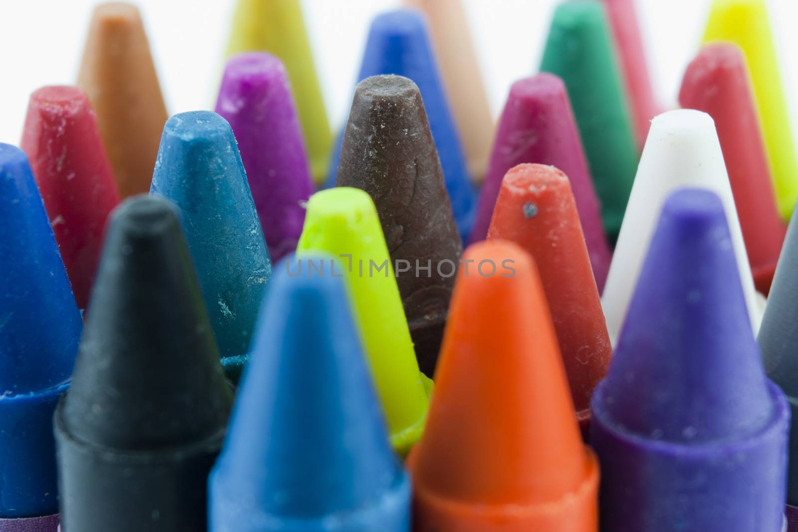 Close up of different coloured crayons