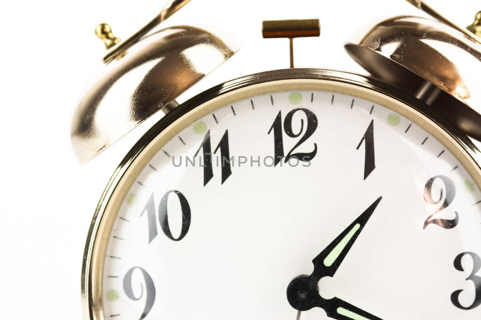 Close up of an alarm clock on a white background