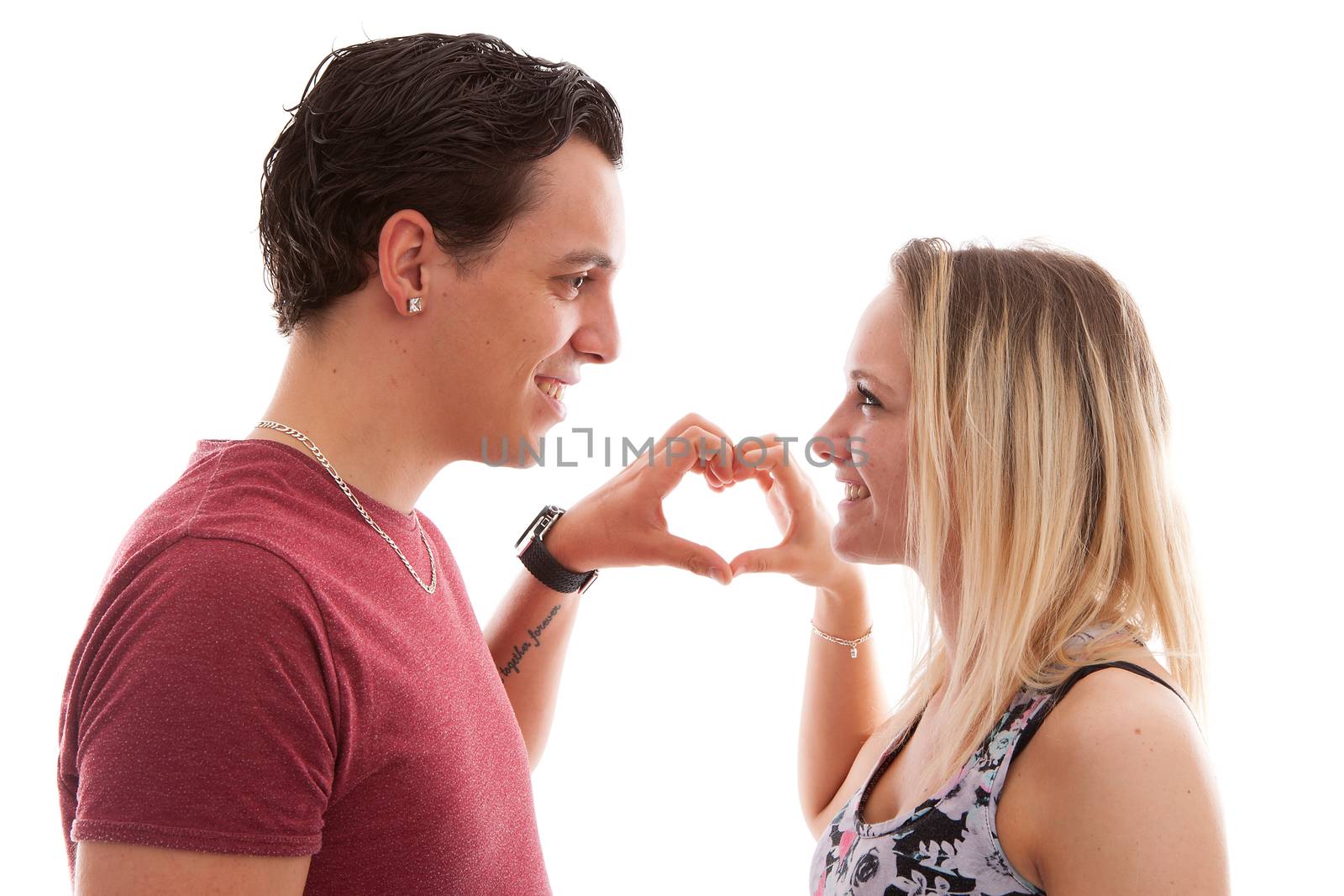 Young couple making heart with hands by sannie32