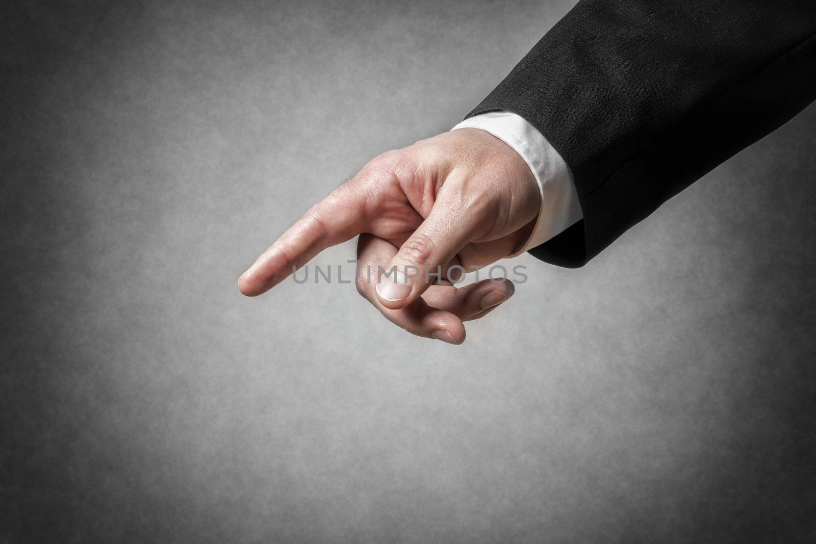Closeup hand with gesture and arm of a businessman in dark suit