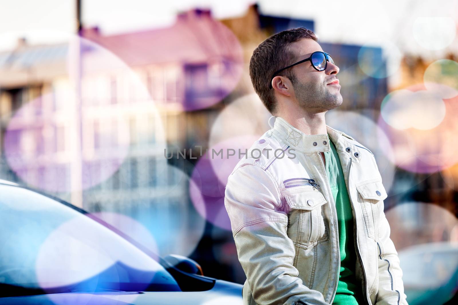 Man portrait in the city.Young man looking at. Abstract urban concept