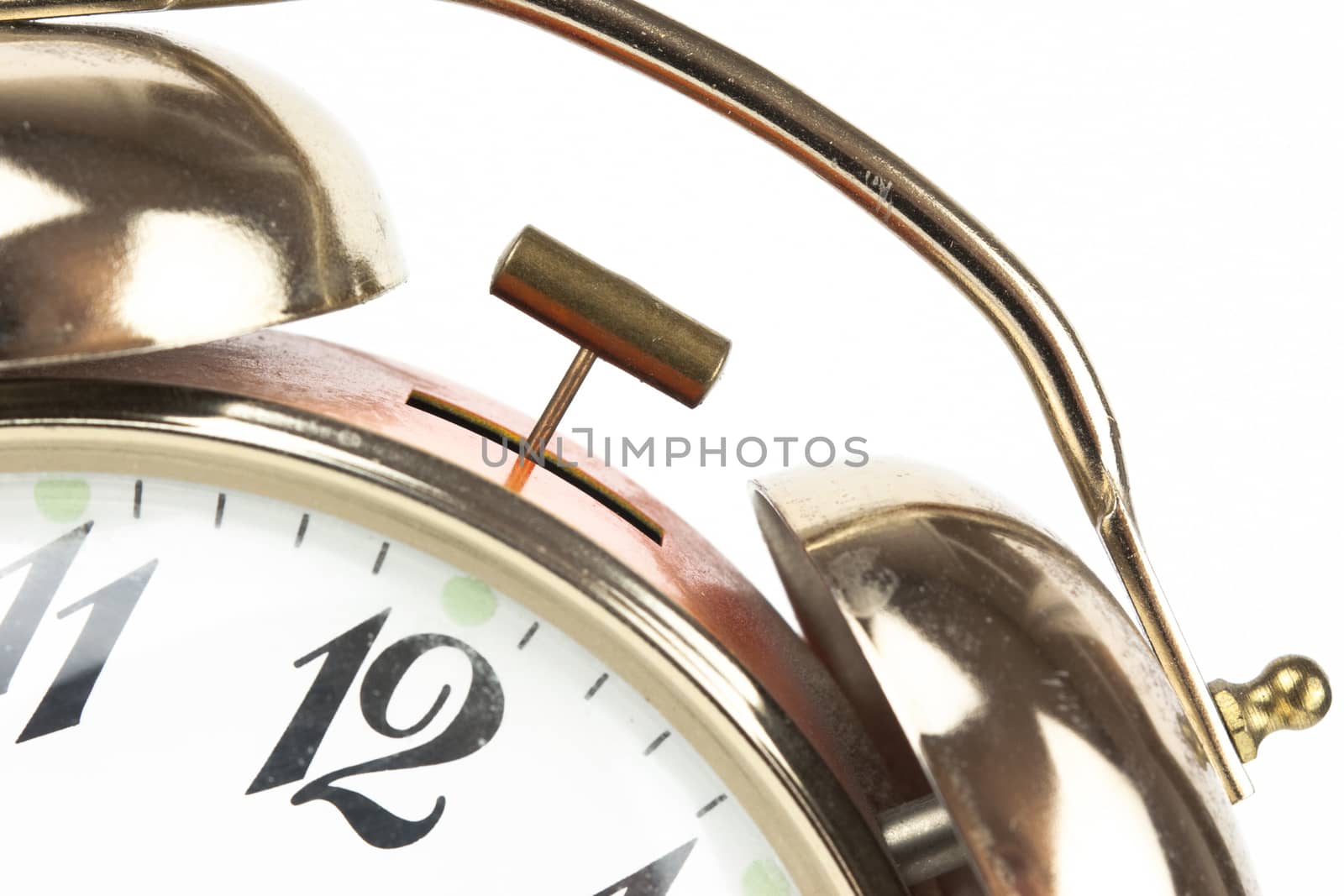 Close up of an alarm clock on a white background