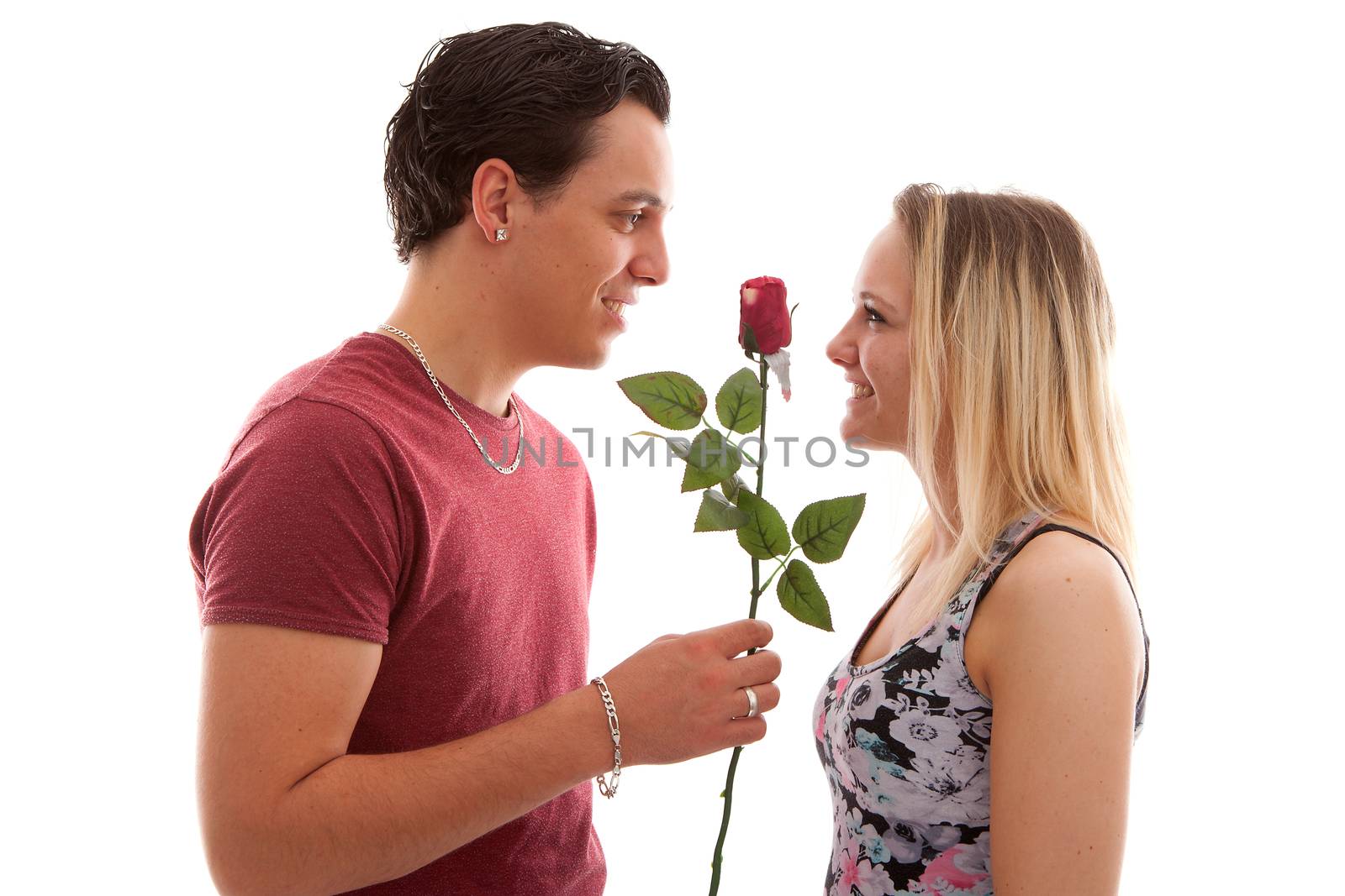 Girl is happy with rose giving by boyfriend over white background