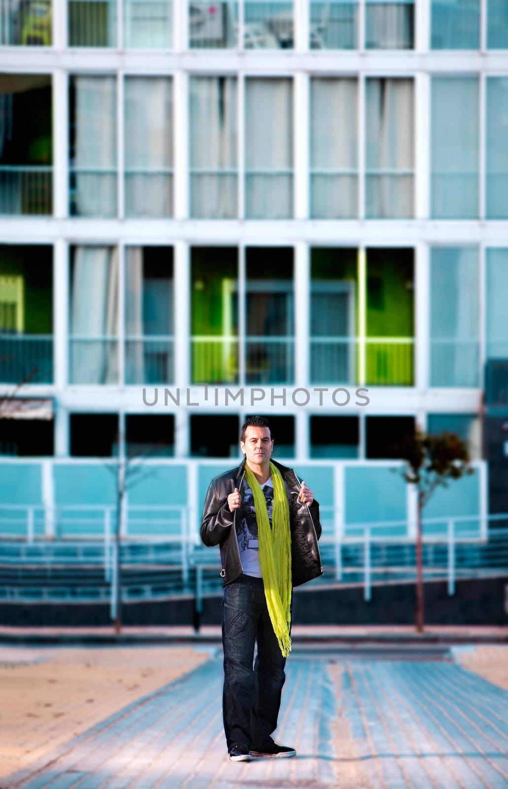 Portrait of man in the city and facade