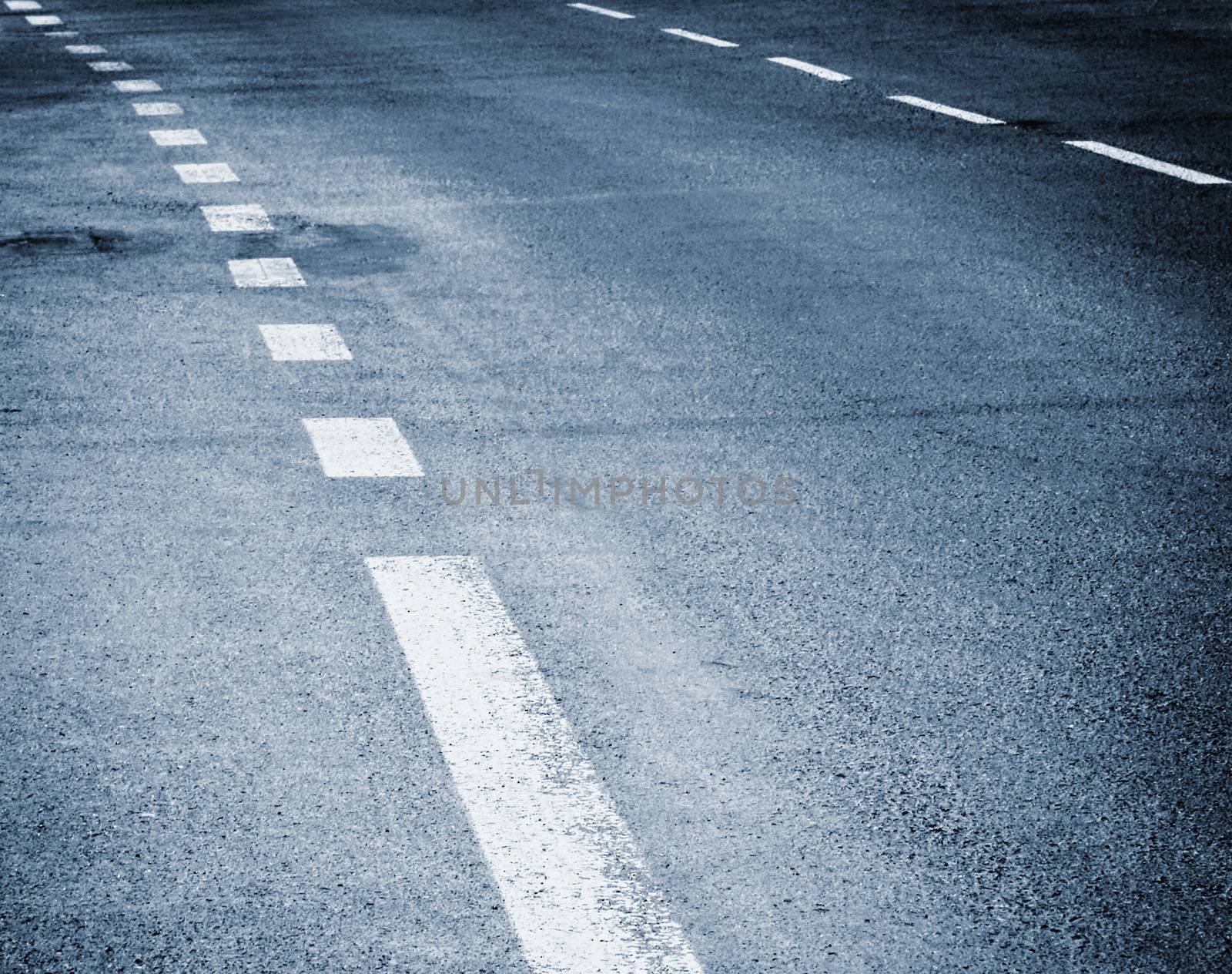 background or texture white stripes on the asphalt road