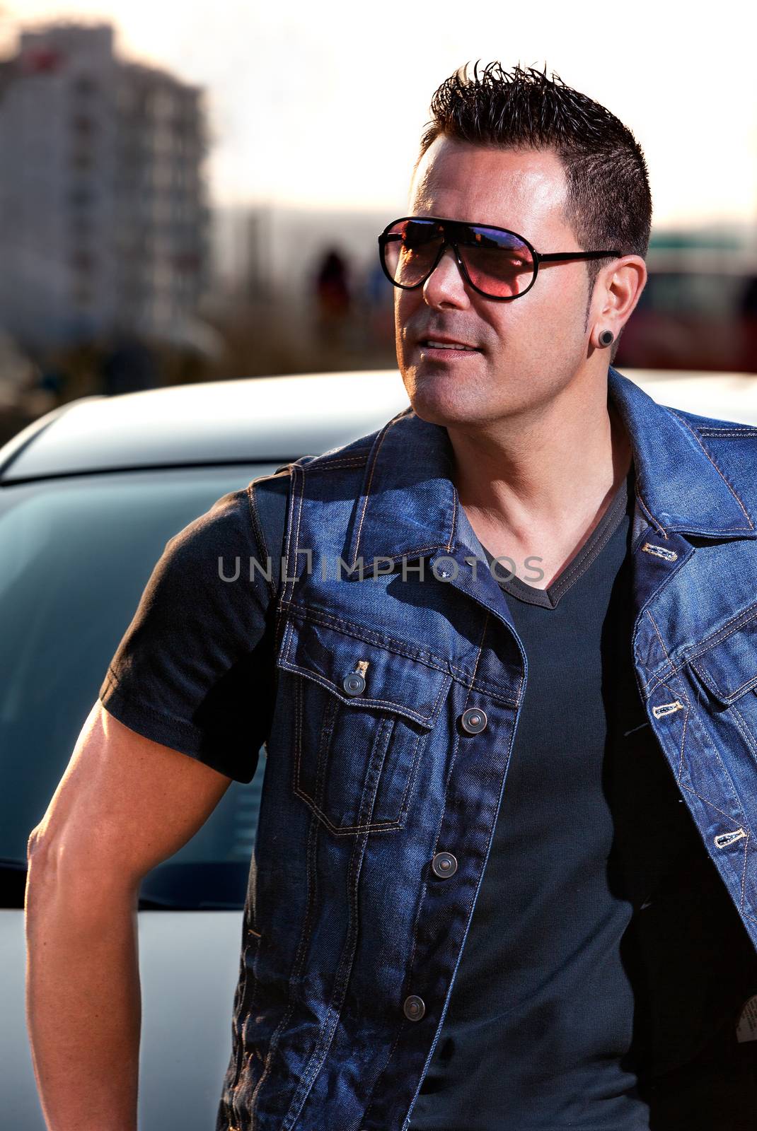 Young man with sunglasses in the city.Urban style