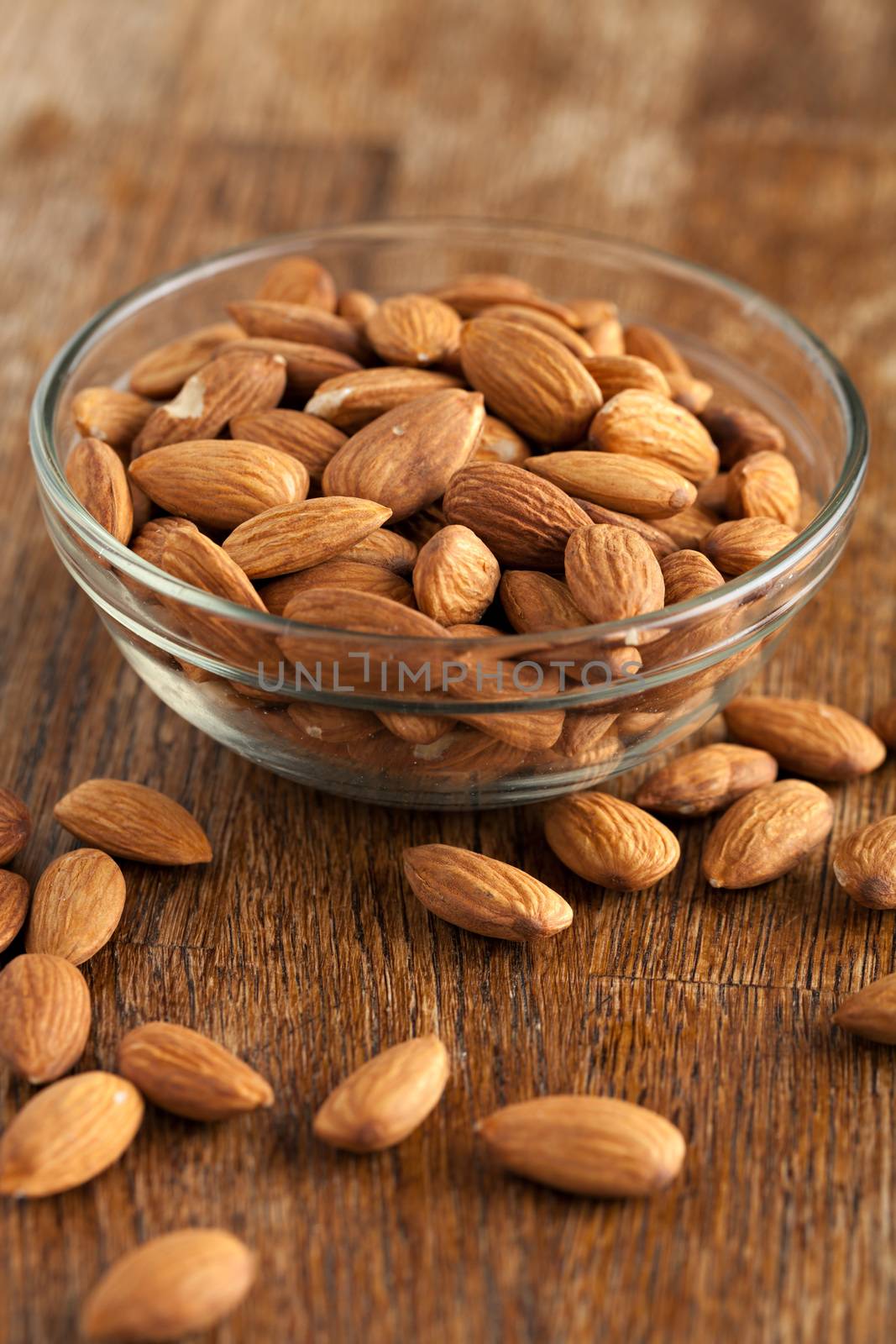 Bowl of Organic Raw Almonds by graficallyminded