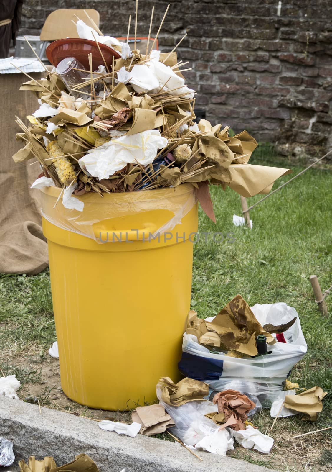 overfull food garbage can trash during a traditional village festival