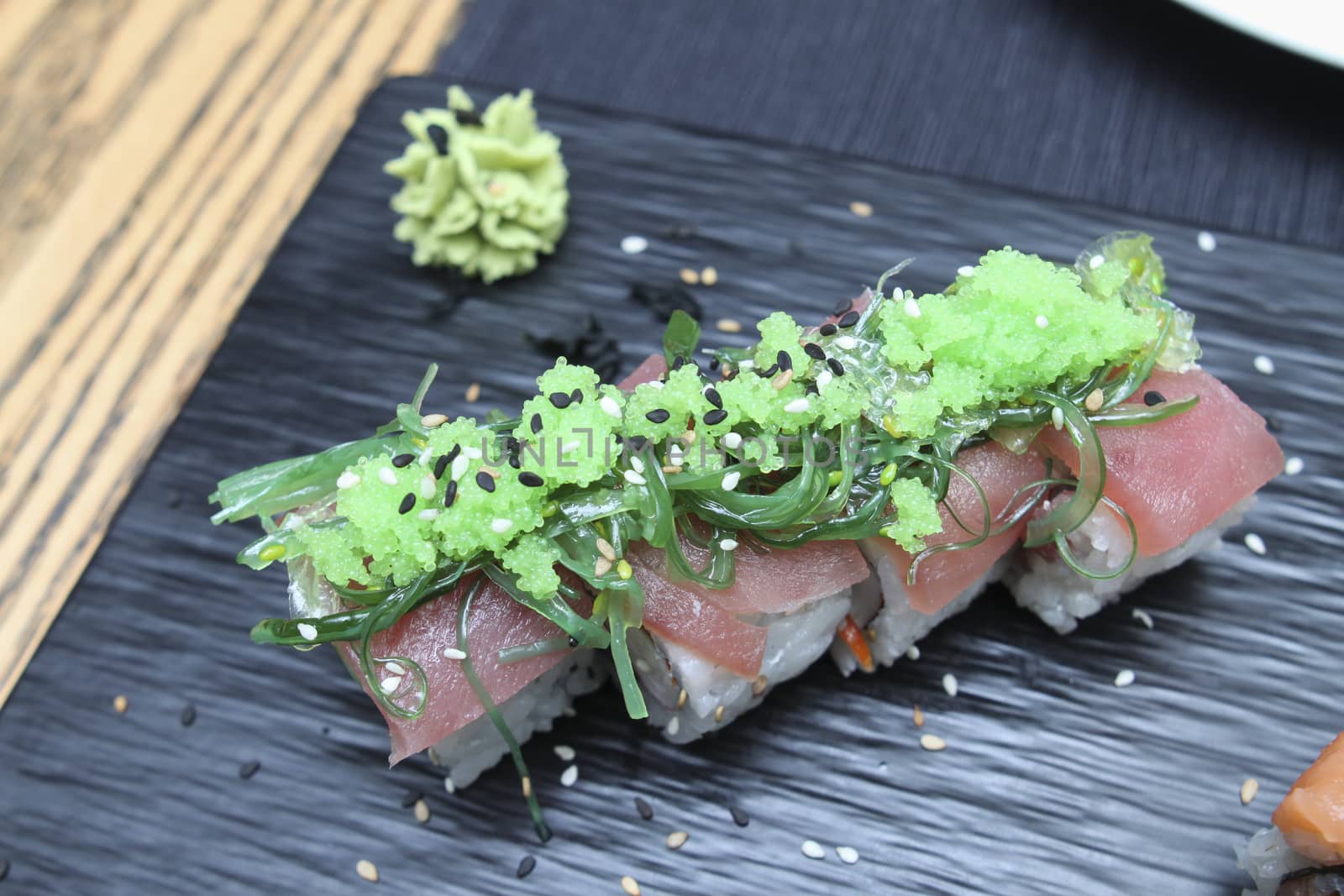 set of tuna sushi on ceramic plate