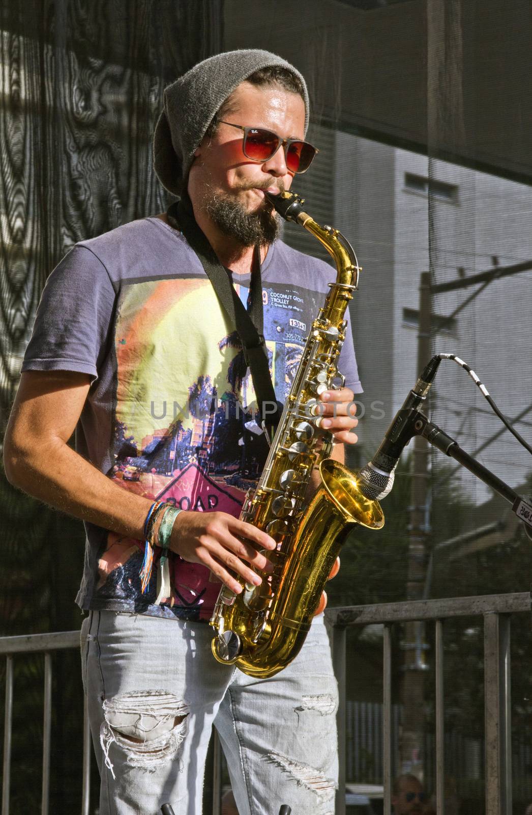 SAO PAULO, BRAZIL - MAY 17, 2015: An unidentified musician  playing saxophone on the street in Sao Paulo, Brazil. 