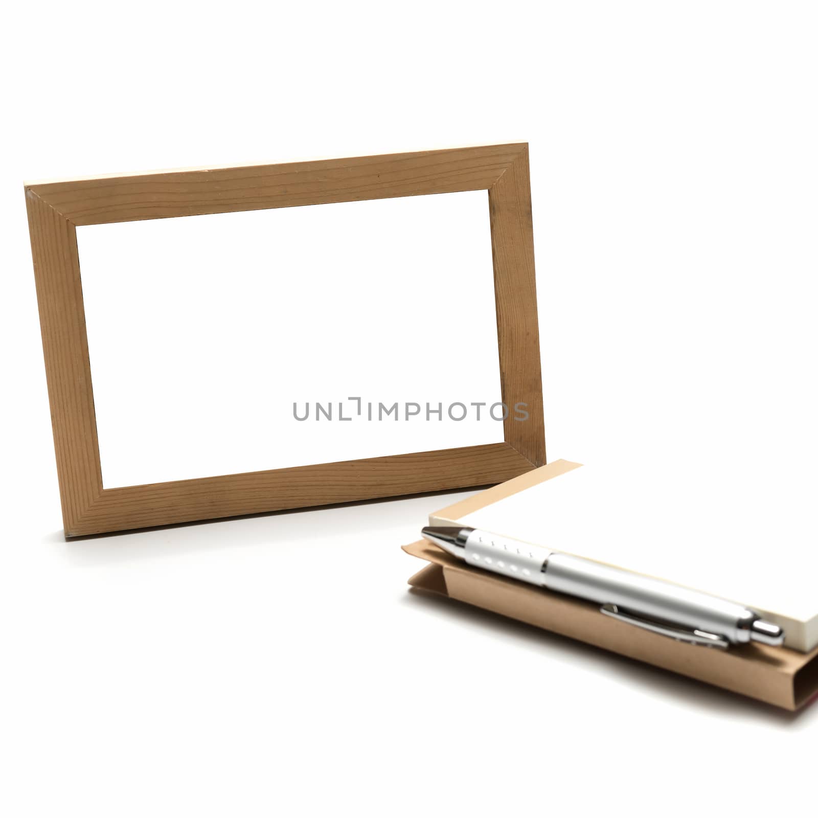 wood photo frame ams notebook with pen isolated on white background
