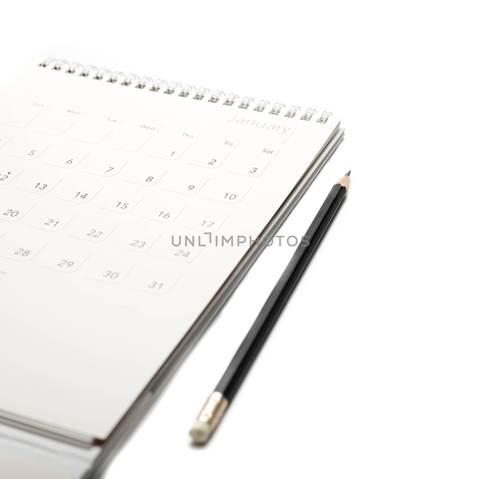 calendar and pencil isolated on white background