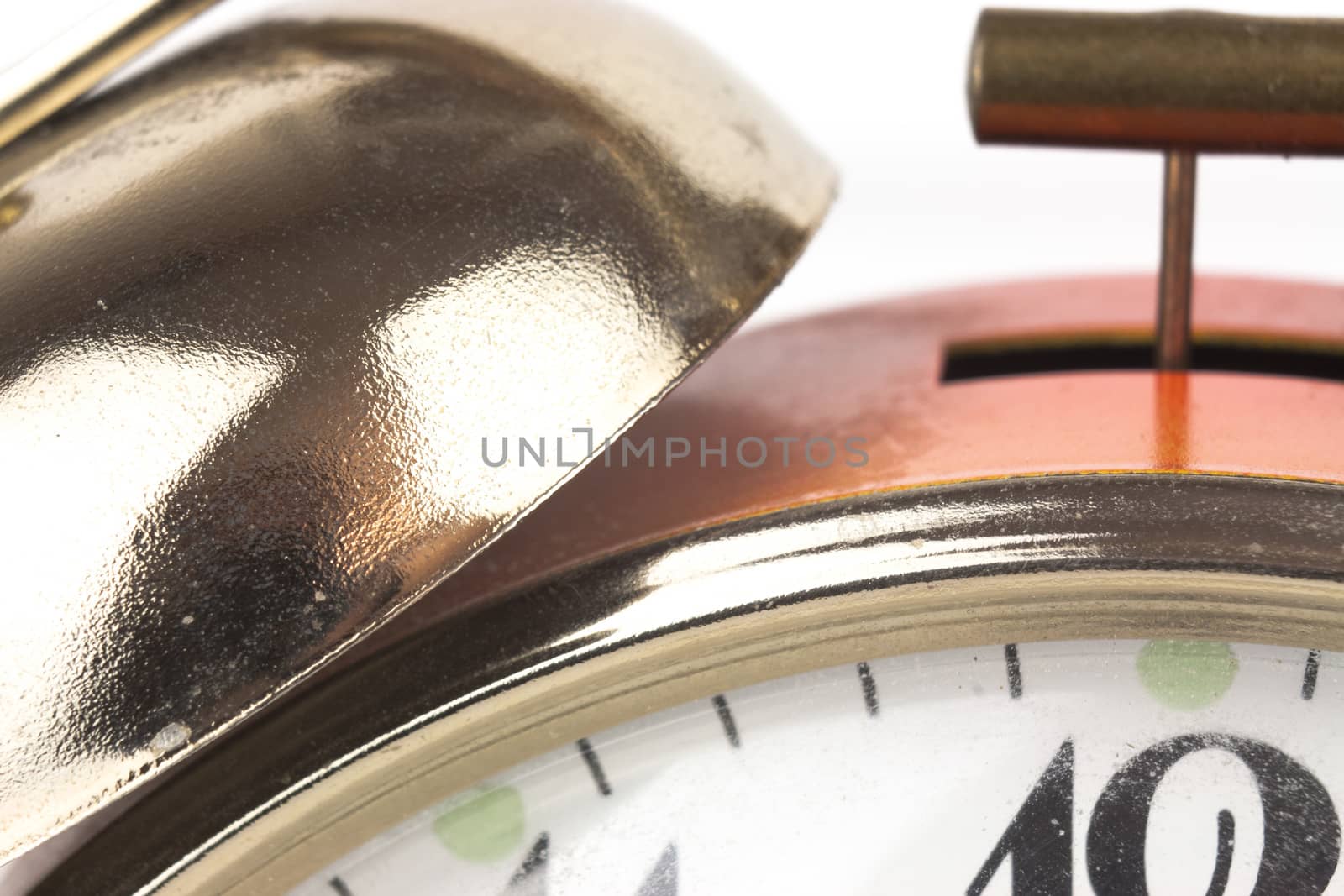 Close up of an alarm clock on a white background