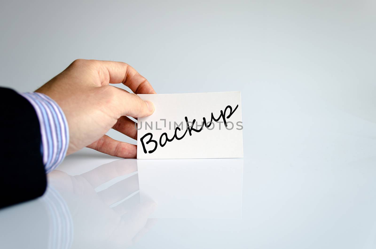Business man hand writing Backup