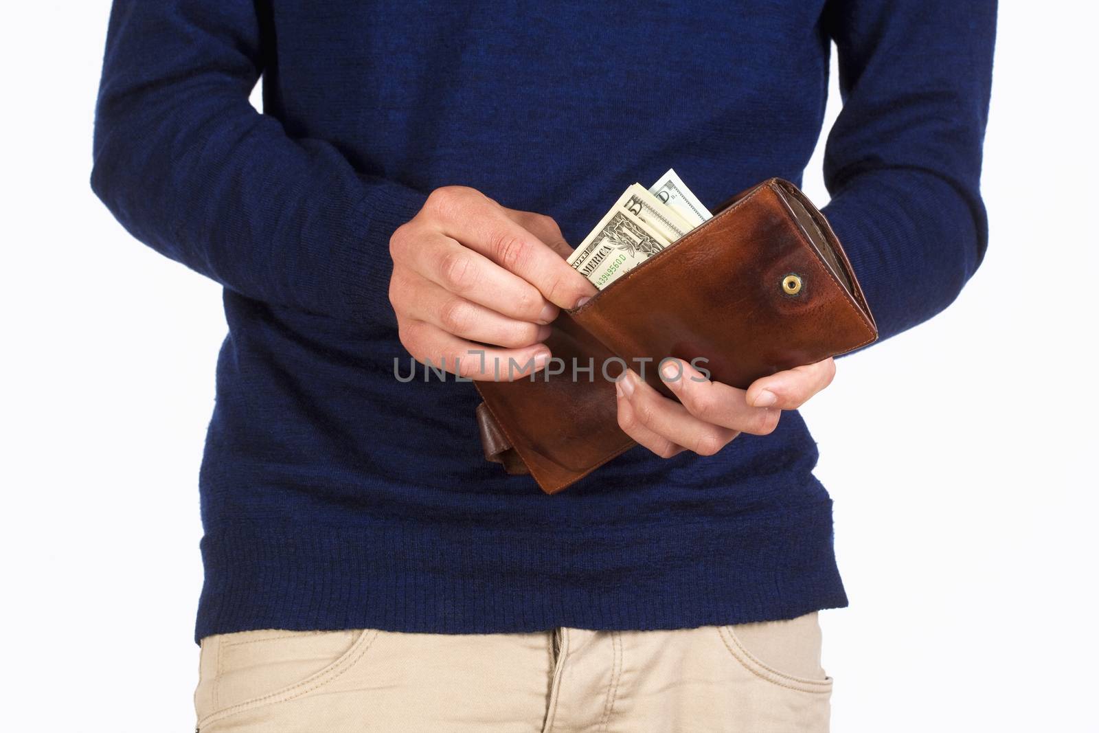 Man Holding a Wallet and Counting Dollars by courtyardpix