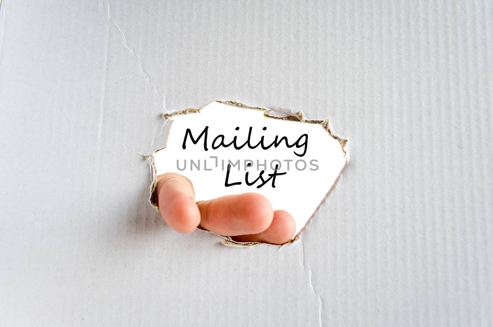 Hand and text on the cardboard background Mailing list concept