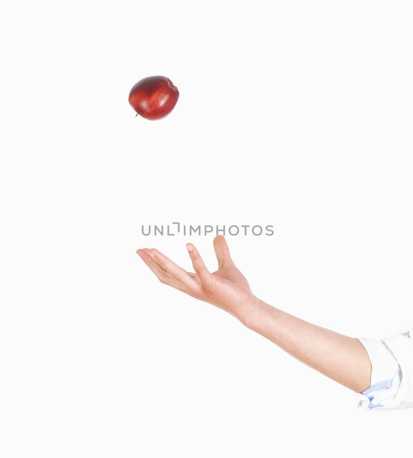 Hand Tossing Red Apple in the Air